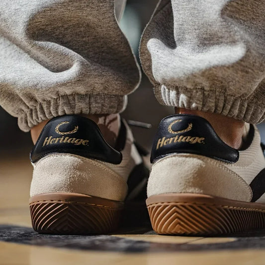 Beige suede and textile low-top trainers with black Heritage heel tab and brown gum sole.