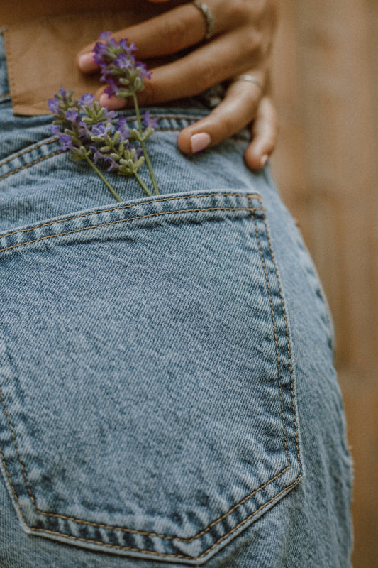 person in blue denim jeans