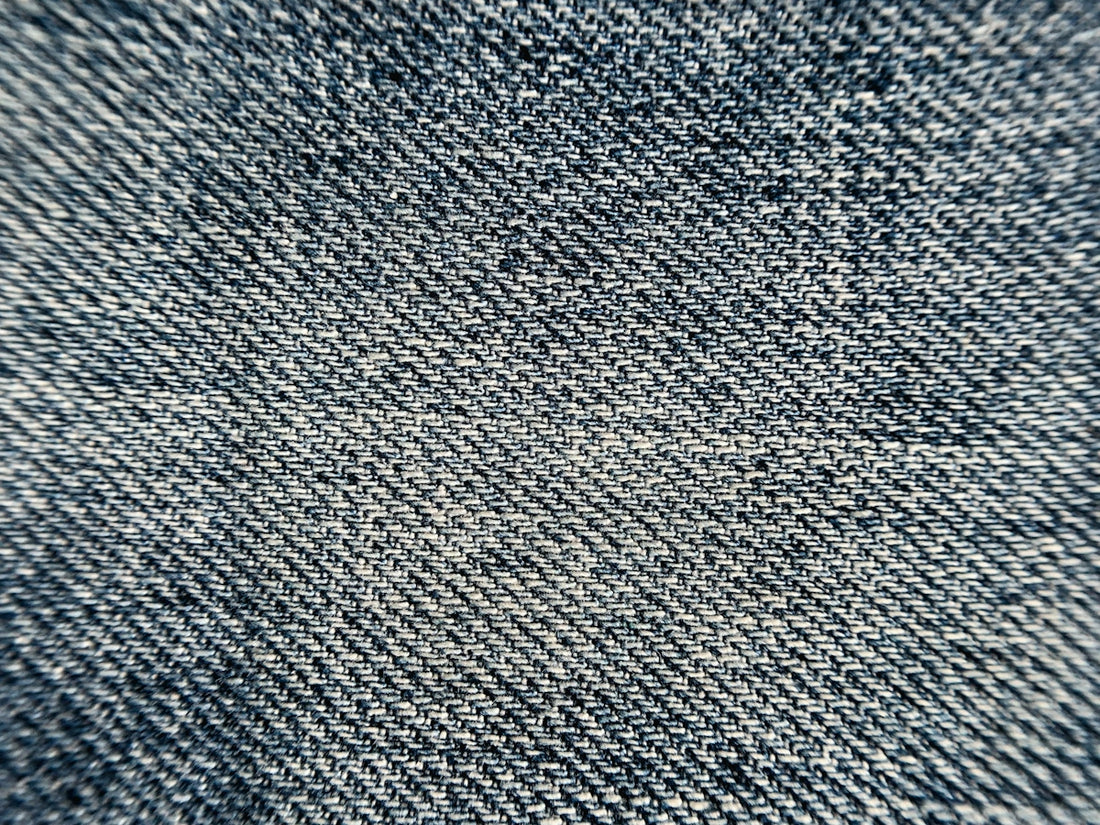 a close up view of a denim fabric texture