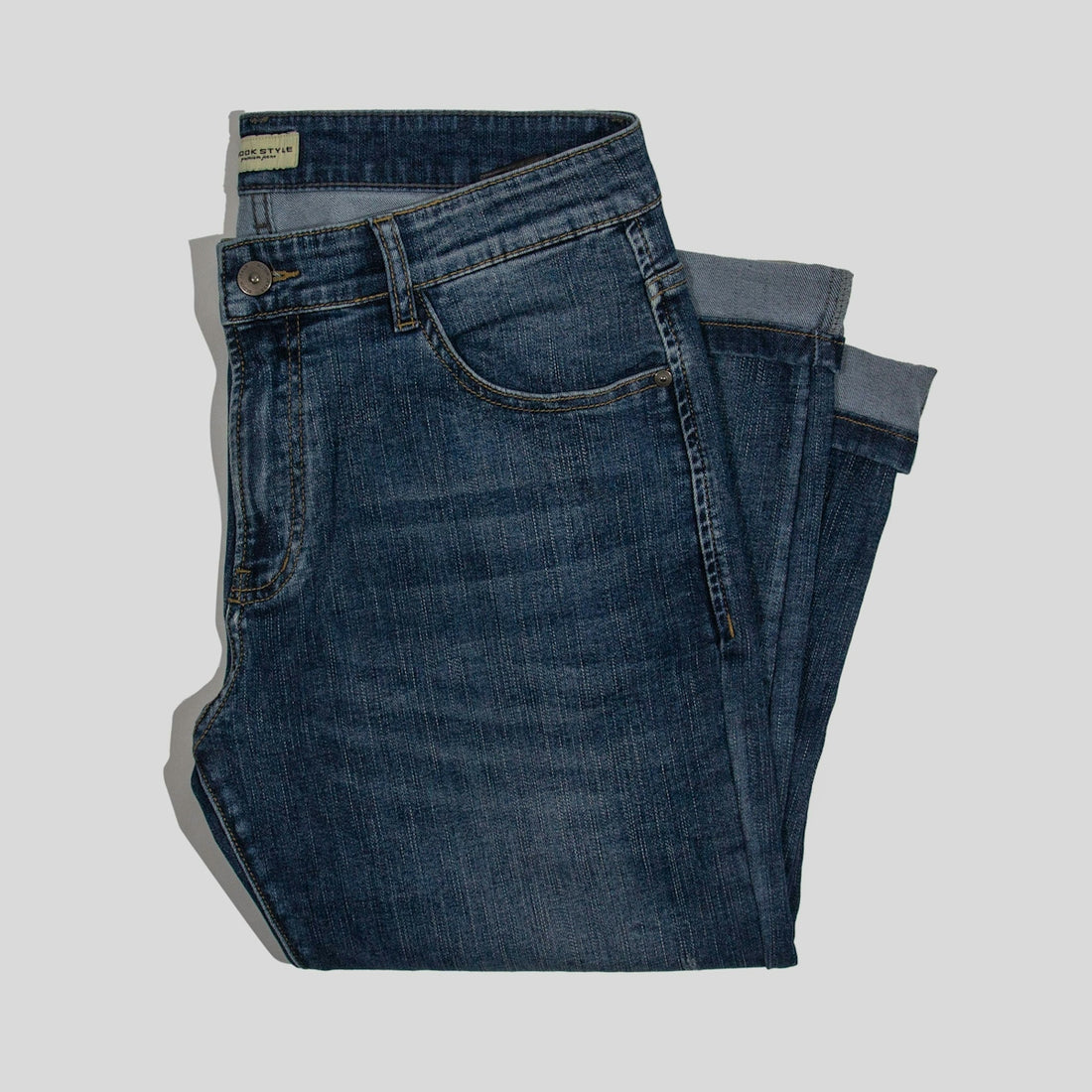 a pair of jeans sitting on top of each other