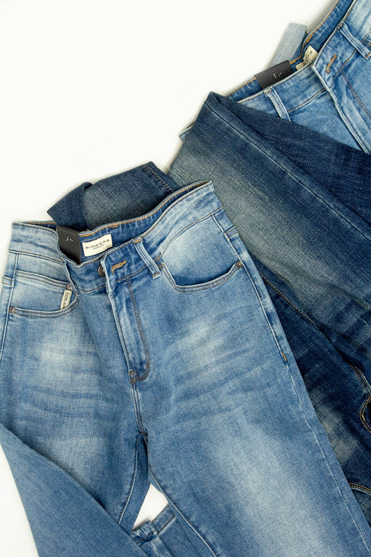 A pair of jeans sitting on top of each other