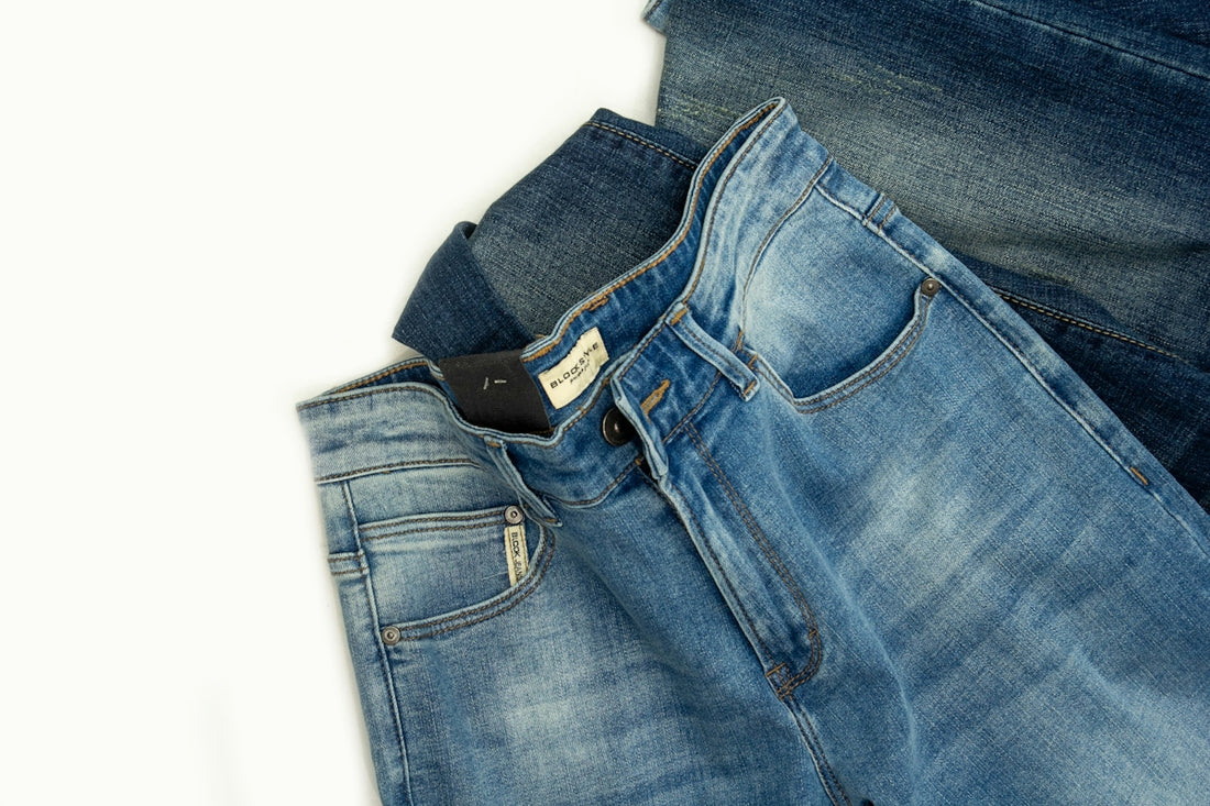 A pair of jeans sitting on top of each other