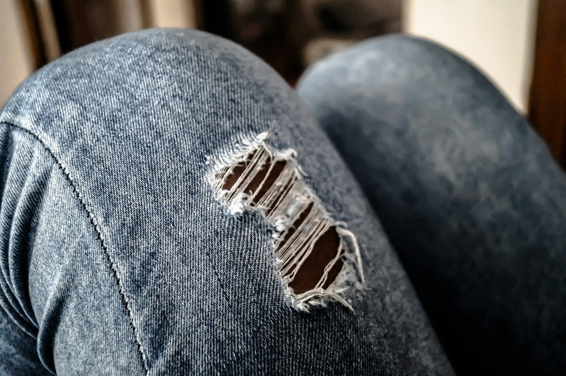 A pair of jeans with a hole in the back
