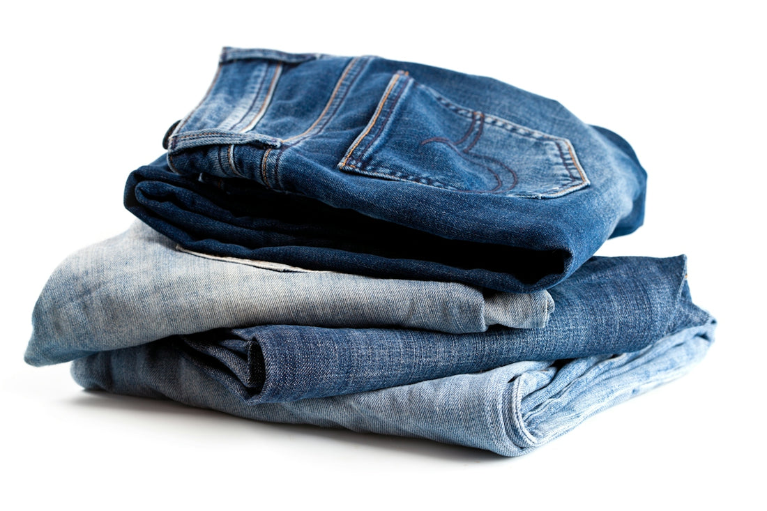 A stack of jeans sitting on top of each other