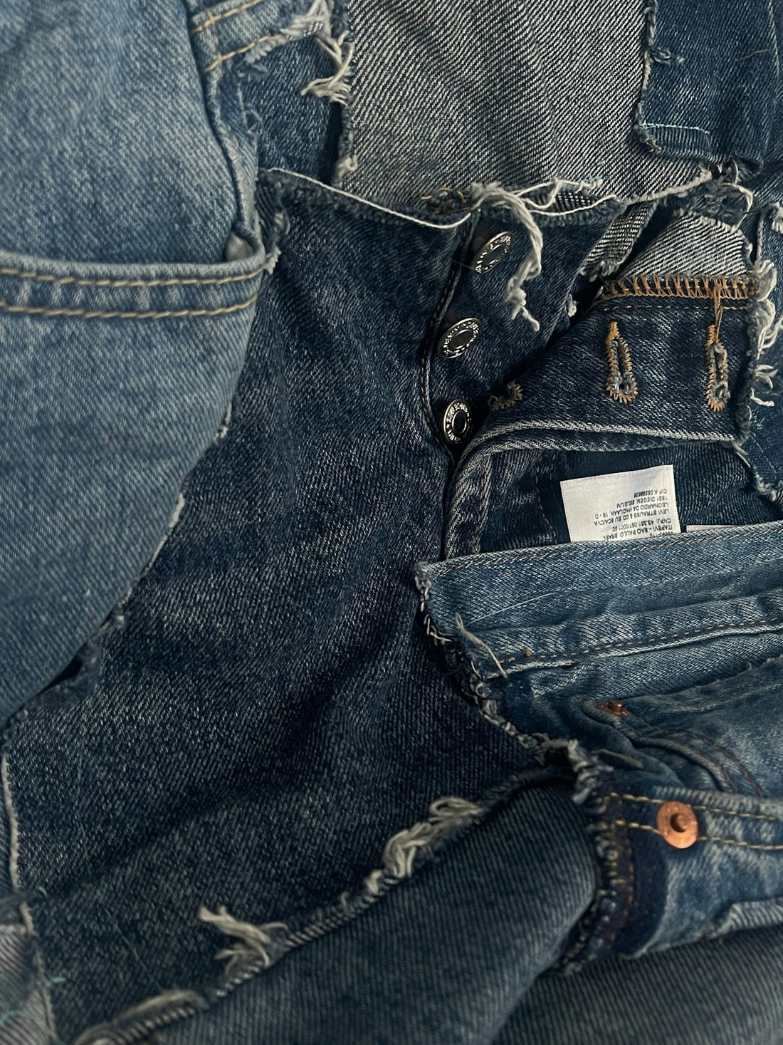 Close-up of patchwork denim clothing.