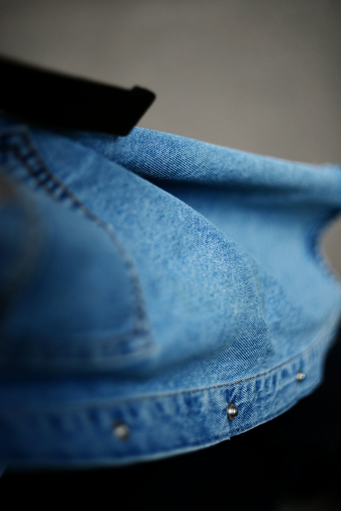 Close-up of a blue denim jacket
