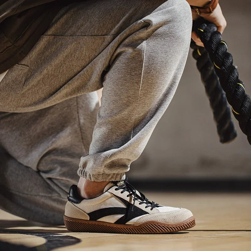Patchwork German Trainers: white low-top sneakers with suede and textile upper, gum sole, lace-up.